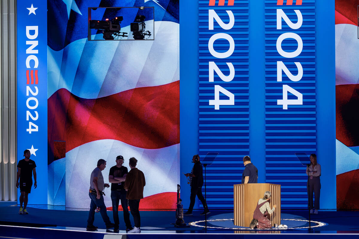 Workers prepare for next week's Democratic National Convention at the United Center in Chicago, ...