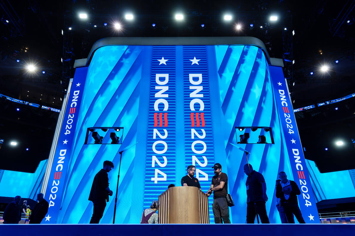 Workers prepare for next week's Democratic National Convention at the United Center in Chicago, ...