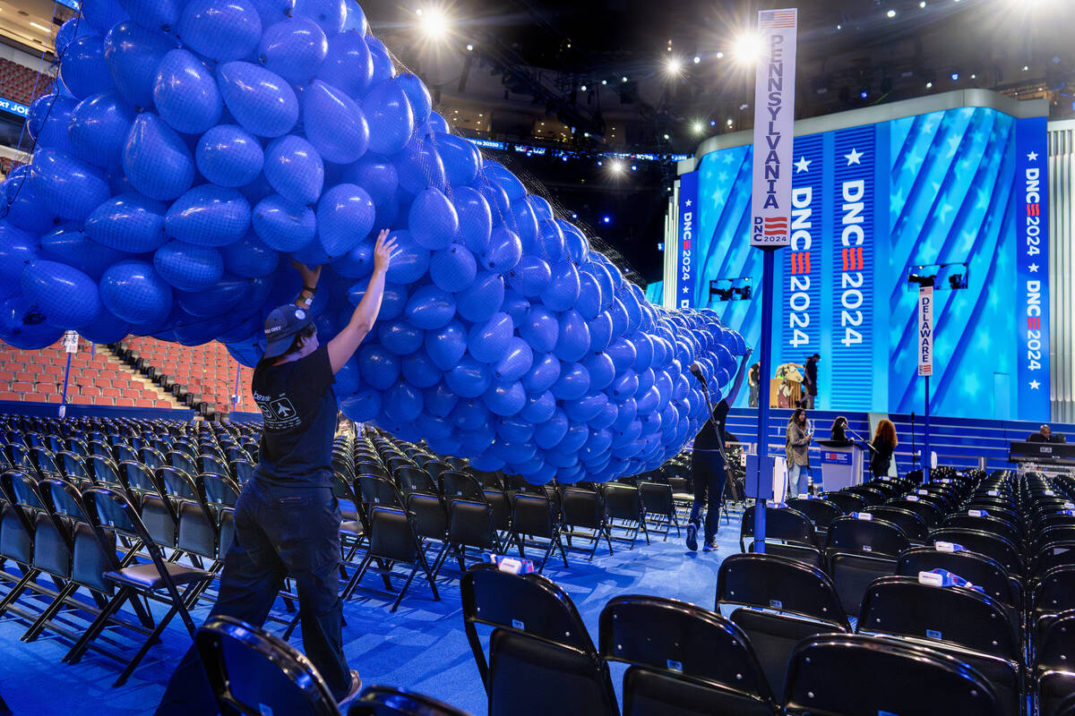 Workers prepare for next week's Democratic National Convention at the United Center in Chicago, ...