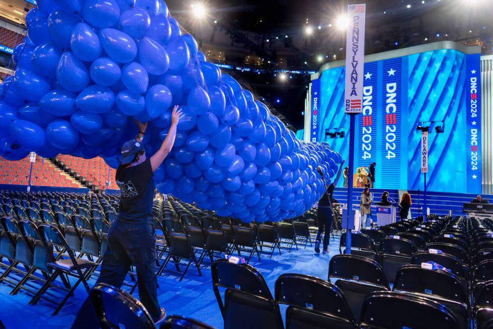 Workers prepare for next week's Democratic National Convention at the United Center in Chicago, ...