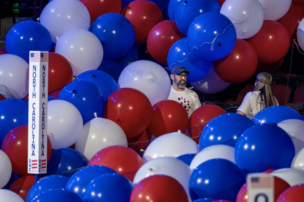 Workers prepare for next week's Democratic National Convention at the United Center in Chicago, ...