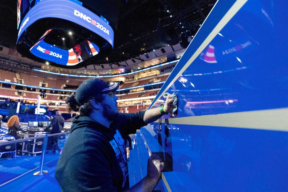 Anthony Albamonte wipes the stage as preparations are made before the upcoming Democratic Natio ...