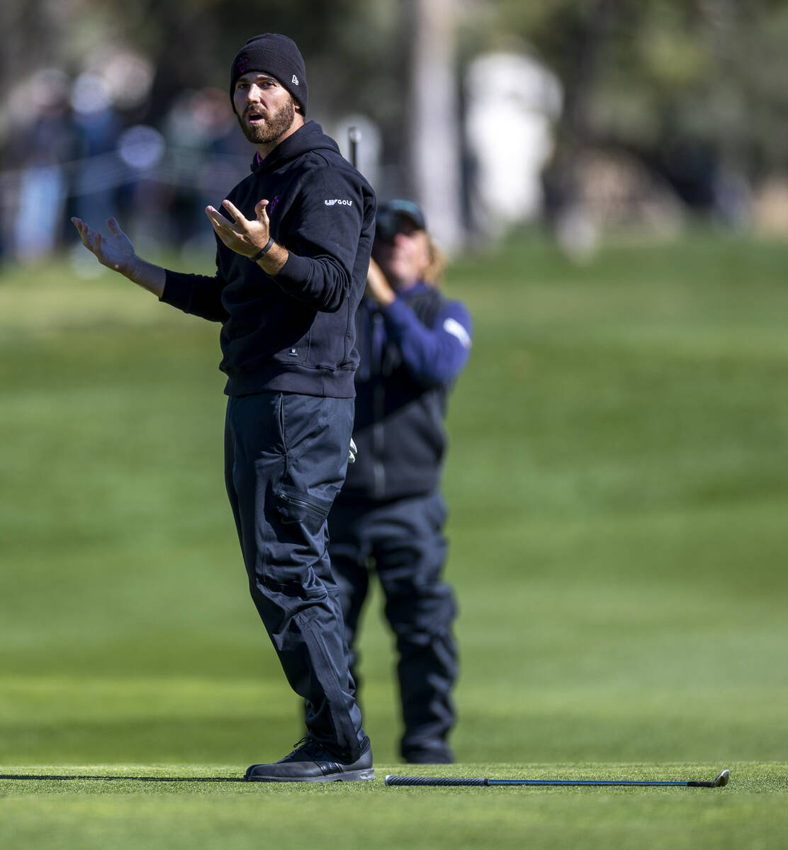 Matthew Wolff reacts to a near sinking as he chips the ball onto the green at hole #15 during t ...