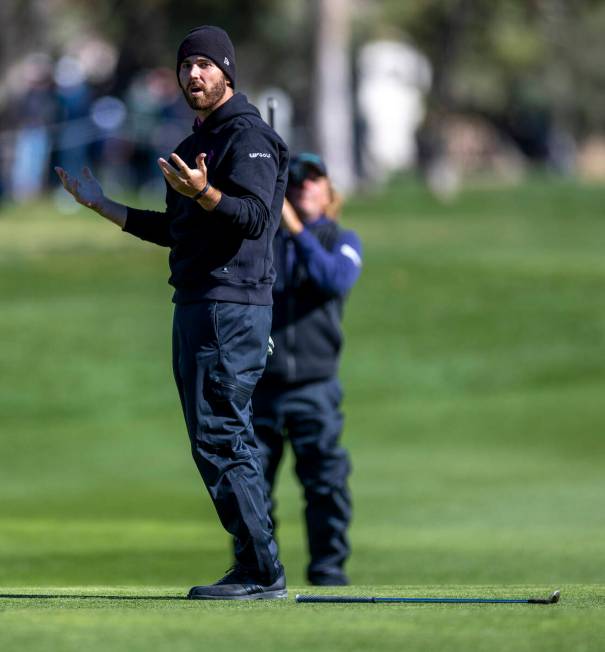 Matthew Wolff reacts to a near sinking as he chips the ball onto the green at hole #15 during t ...