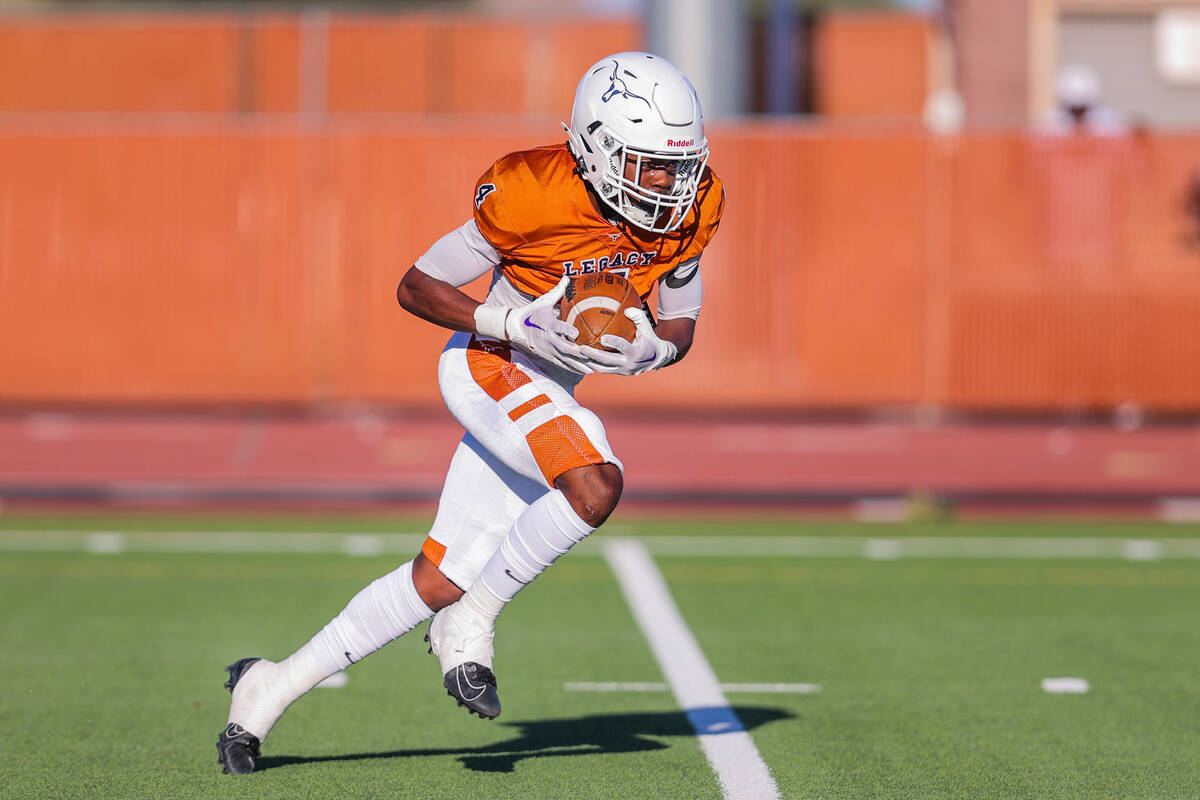 Legacy cornerback/wide receiver Jayden Bridgewater (4) runs the ball for a touchdown during a f ...