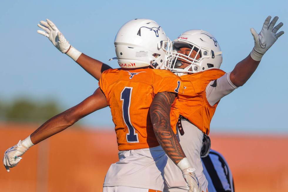 Legacy cornerback/wide receiver Jayden Bridgewater (4) celebrates a touchdown with teammate Dom ...