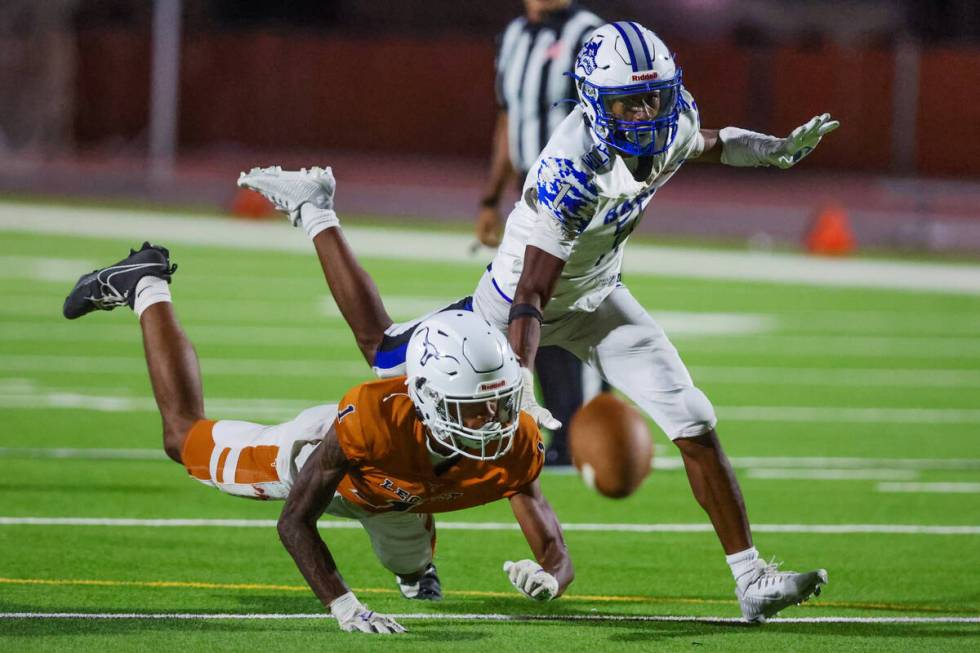 Legacy wide receiver Dominic Oliver (1) goes down as Donovan Glover (1) covers him during a foo ...