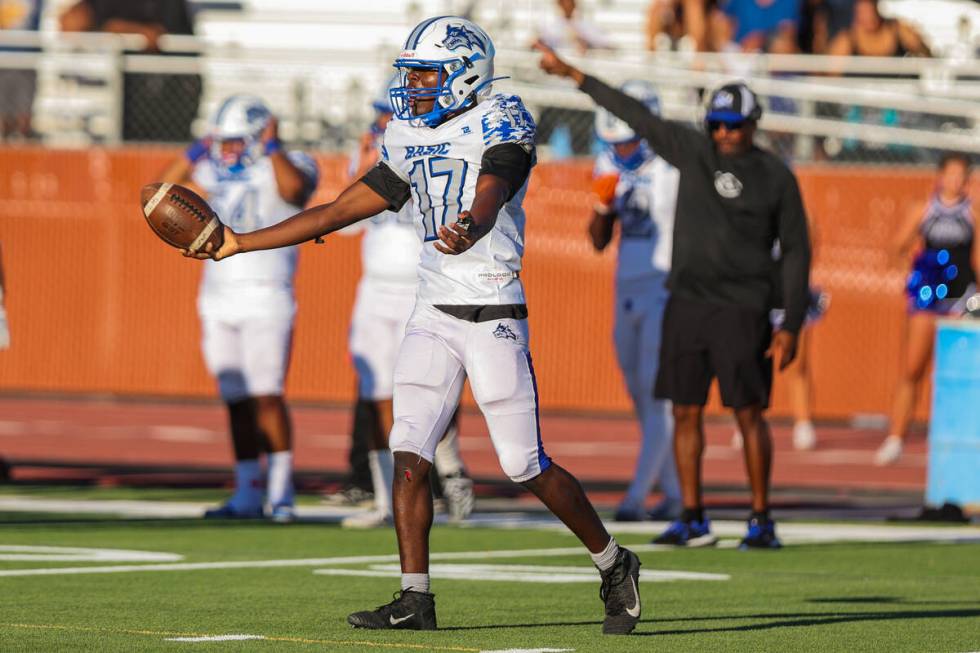 Basic’s Silvan David (17) reacts to a call by a referee during a football game between L ...