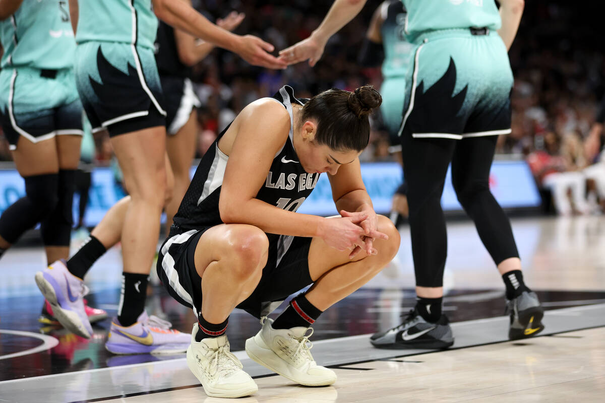 Las Vegas Aces guard Kelsey Plum (10) reacts after being charged with an offensive foul during ...