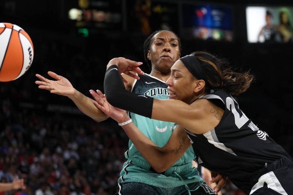 Las Vegas Aces center A'ja Wilson (22) loses control of the ball while New York Liberty forward ...