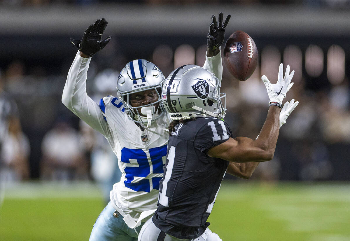 Raiders wide receiver Tre Tucker (11) looks in a long pass over Dallas Cowboys cornerback Andre ...