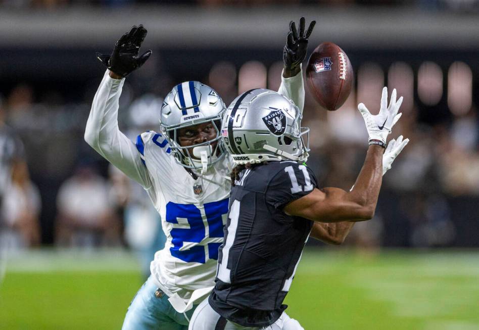 Raiders wide receiver Tre Tucker (11) looks in a long pass over Dallas Cowboys cornerback Andre ...