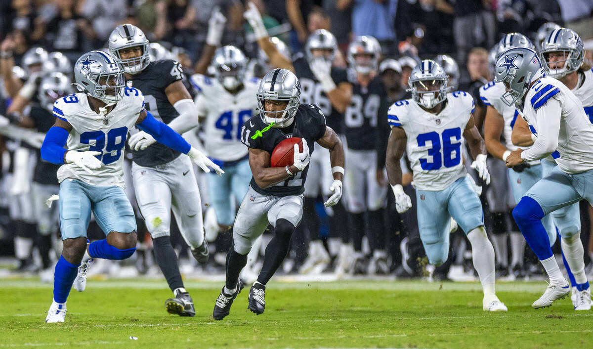 Raiders wide receiver Tre Tucker (11) makes a big kickoff return against the Dallas Cowboys dur ...