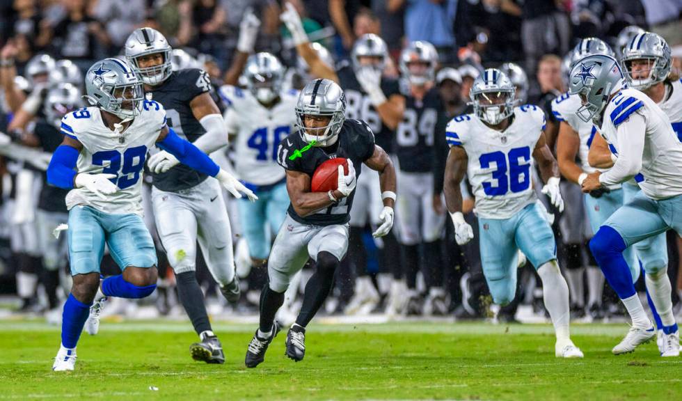 Raiders wide receiver Tre Tucker (11) makes a big kickoff return against the Dallas Cowboys dur ...