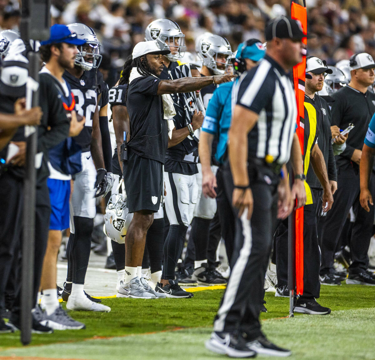 Raiders wide receiver Davante Adams (17) watches the game from the sidelines against the Dallas ...