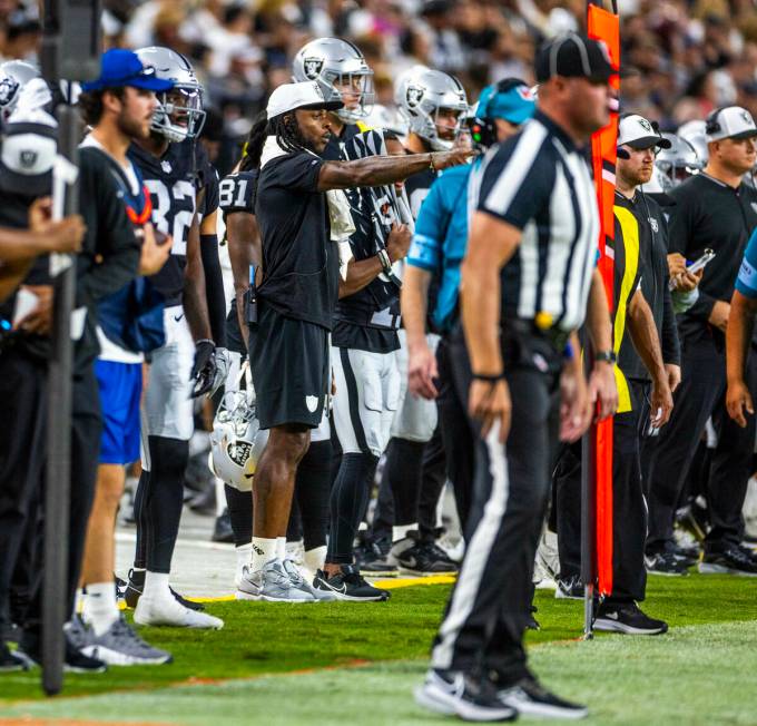 Raiders wide receiver Davante Adams (17) watches the game from the sidelines against the Dallas ...