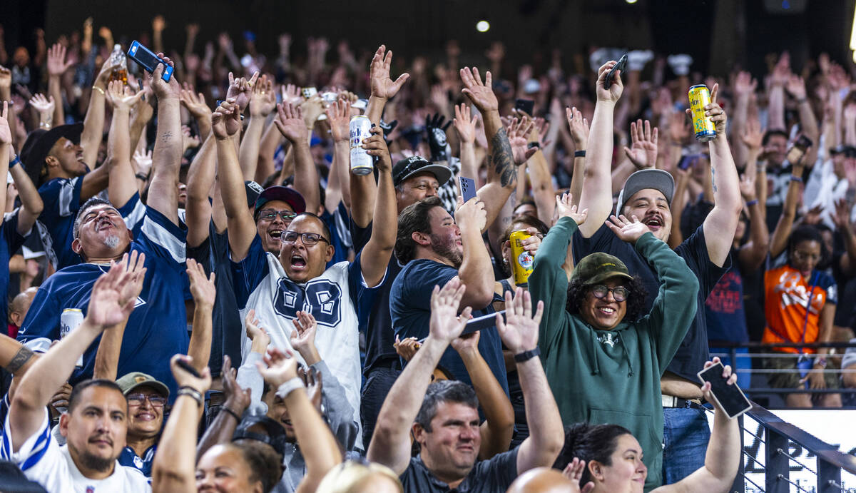 Fans do the wave as the Raiders battle the Dallas Cowboys during the second half of their NFL p ...