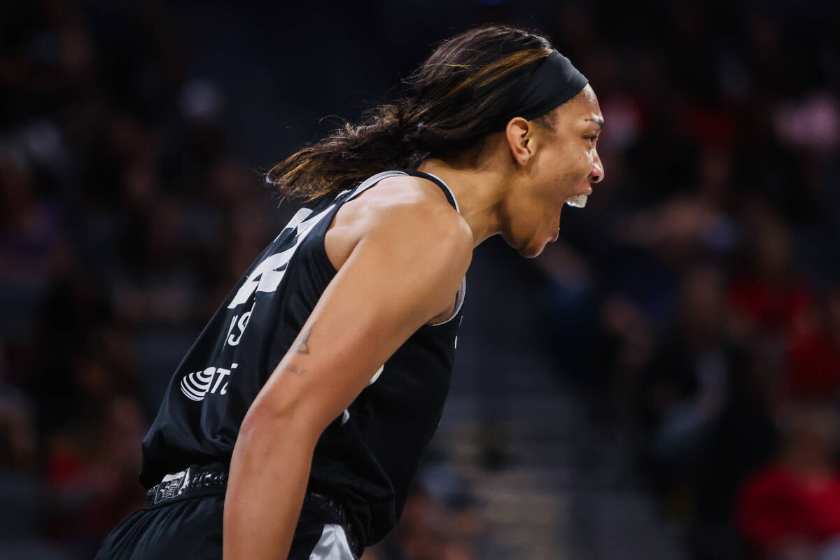 Aces center A'ja Wilson (22) gets amped up during a WNBA basketball game between the Aces and t ...