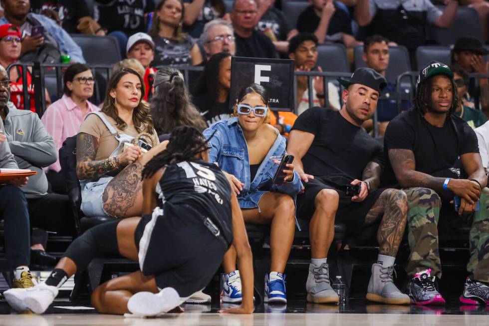 The crowd reacts as Aces guard Tiffany Hayes (15) falls near the sidelines during a WNBA baske ...