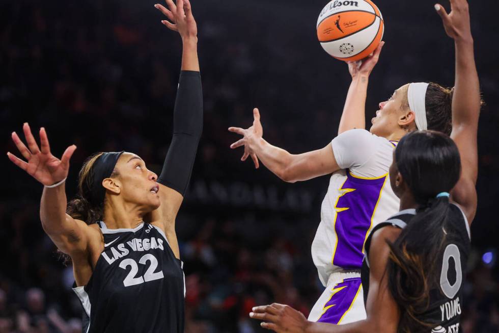 Los Angeles Sparks forward Dearica Hamby (5) jumps up for a basket as Aces center A'ja Wilson ...