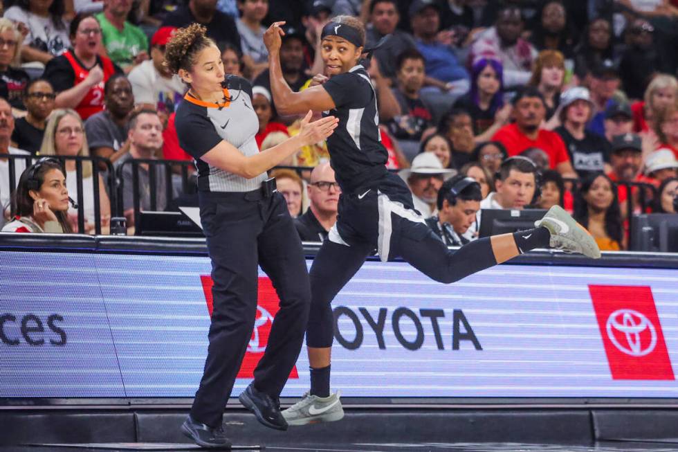 Aces guard Sydney Colson (51) runs into a referee during a WNBA basketball game between the Ace ...