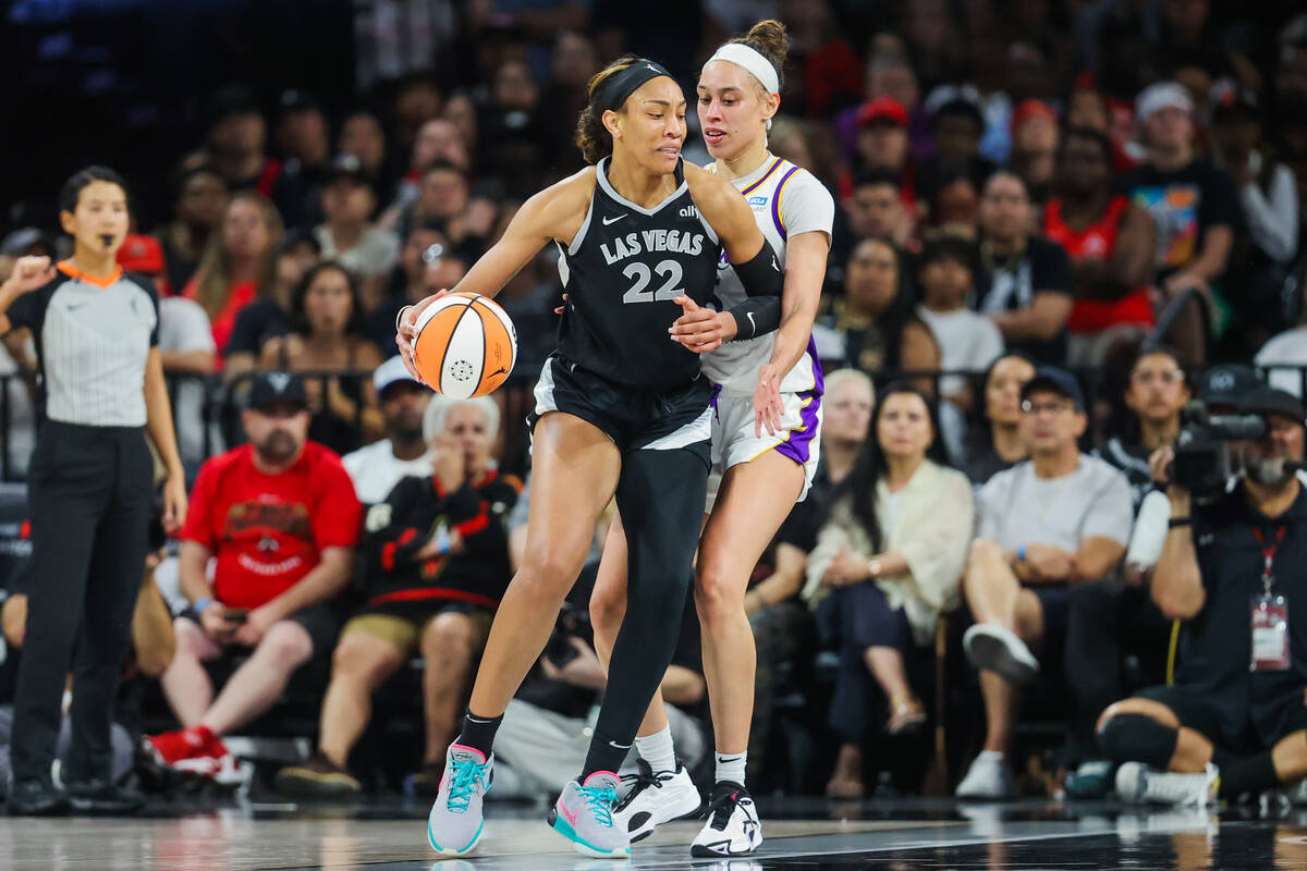 Los Angeles Sparks forward Dearica Hamby (5) guards Aces center A'ja Wilson (22) during a WNBA ...