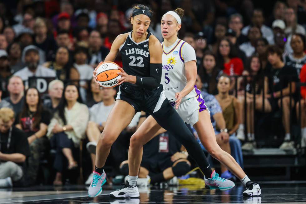 Los Angeles Sparks forward Dearica Hamby (5) guards Aces center A'ja Wilson (22) during a WNBA ...