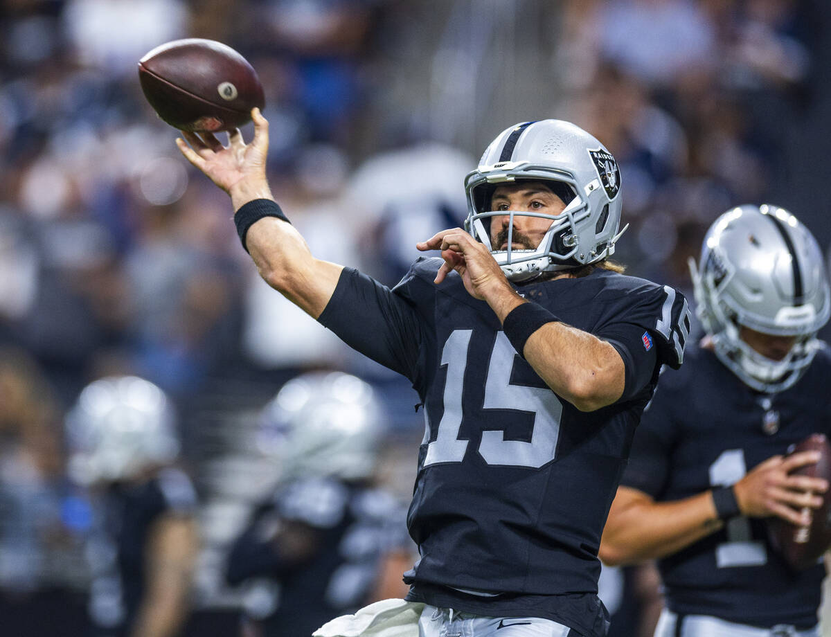 Raiders quarterback Gardner Minshew (15) gets off a pass during warm ups before the first half ...