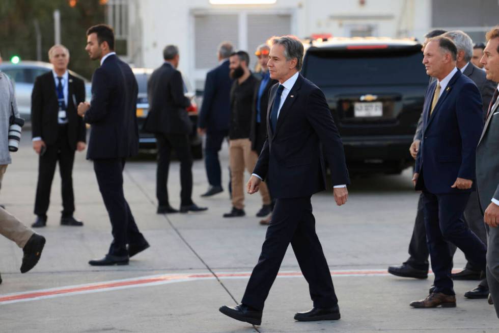 U.S. Secretary of State Antony Blinken walks after his arrival in Tel Aviv, Israel, Sunday, Aug ...