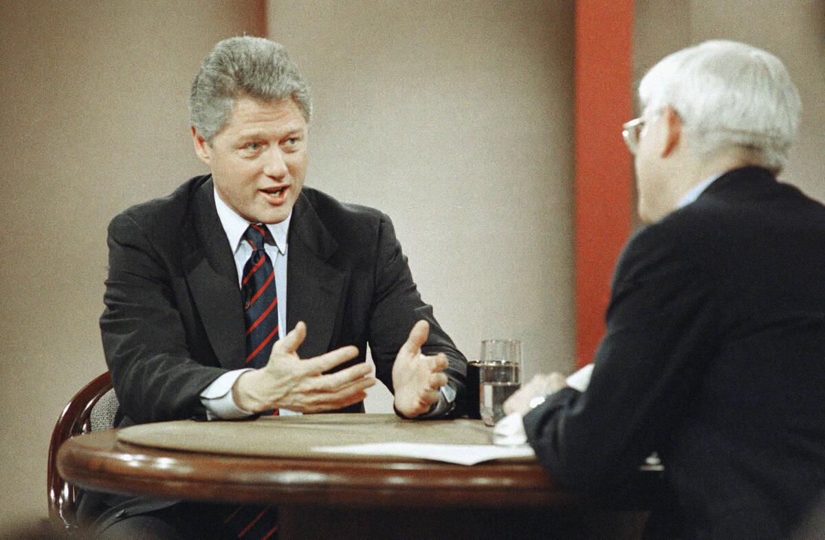 FILE - Democratic presidential hopeful Gov. Bill Clinton, gestures as he speaks to Phil Donahue ...