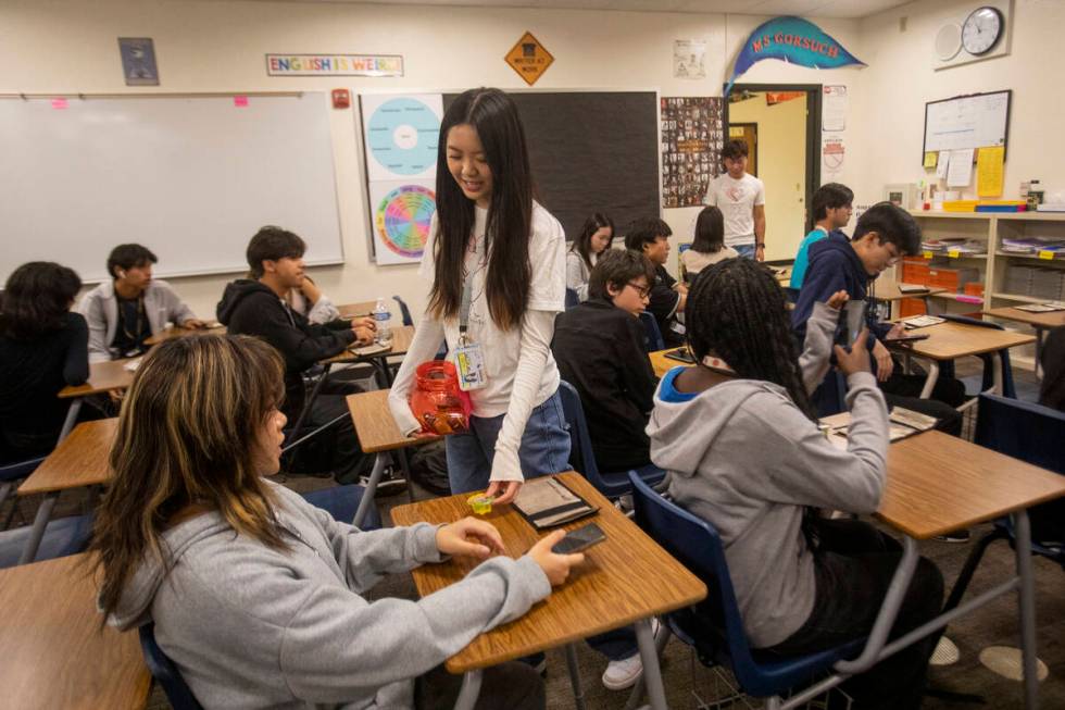 Giving to Kids Co-Program Coordinator Hanna Hoang passes out sweets after new and returning mem ...