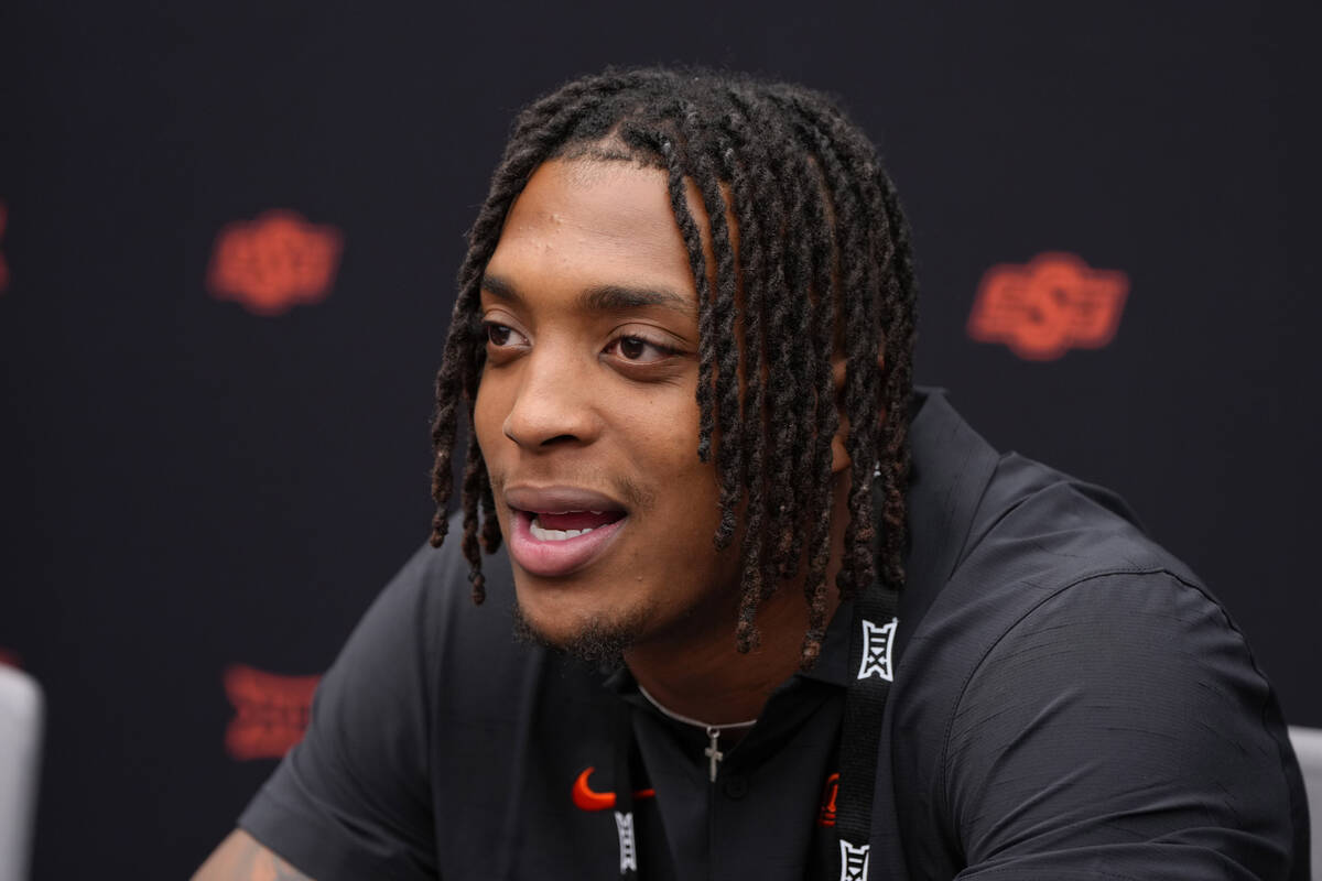 FILE - Oklahoma State running back Ollie Gordon II answers questions from the media during the ...