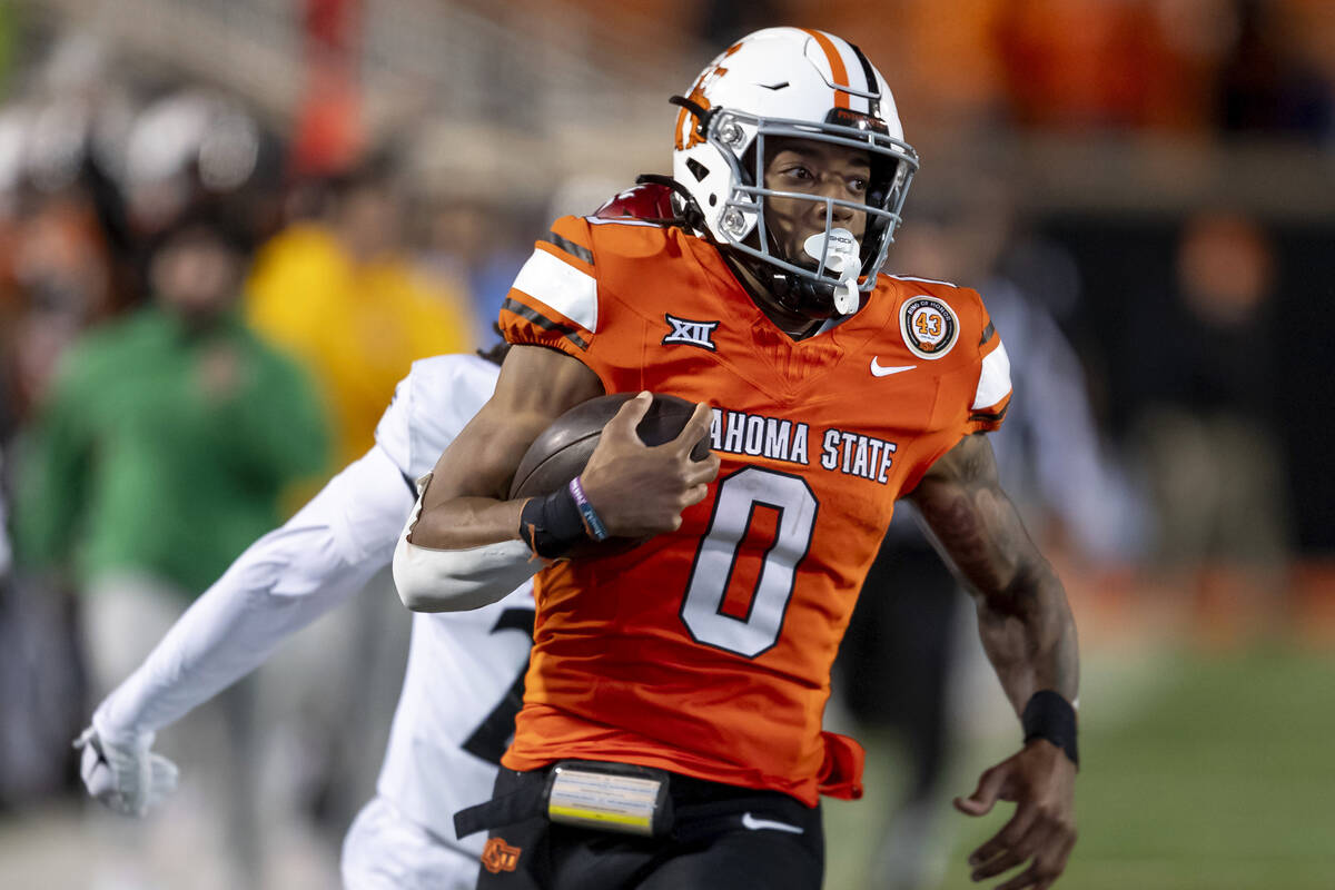 FILE - Oklahoma State running back Ollie Gordon II (0) runs for a touchdown during the second h ...