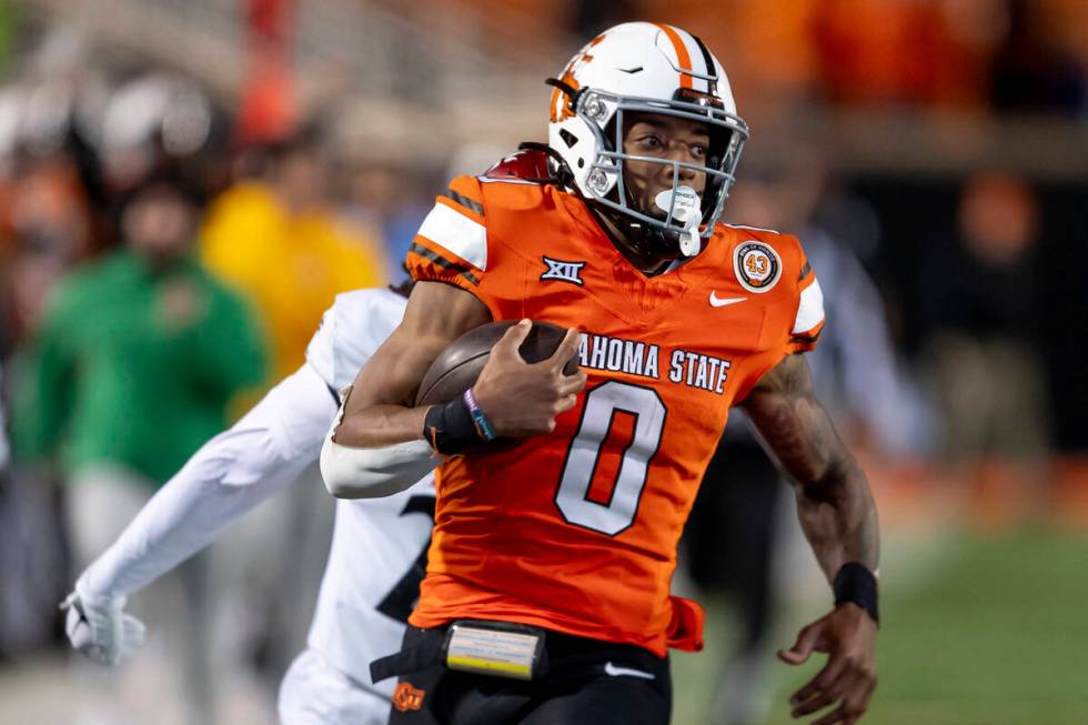 FILE - Oklahoma State running back Ollie Gordon II (0) runs for a touchdown during the second h ...