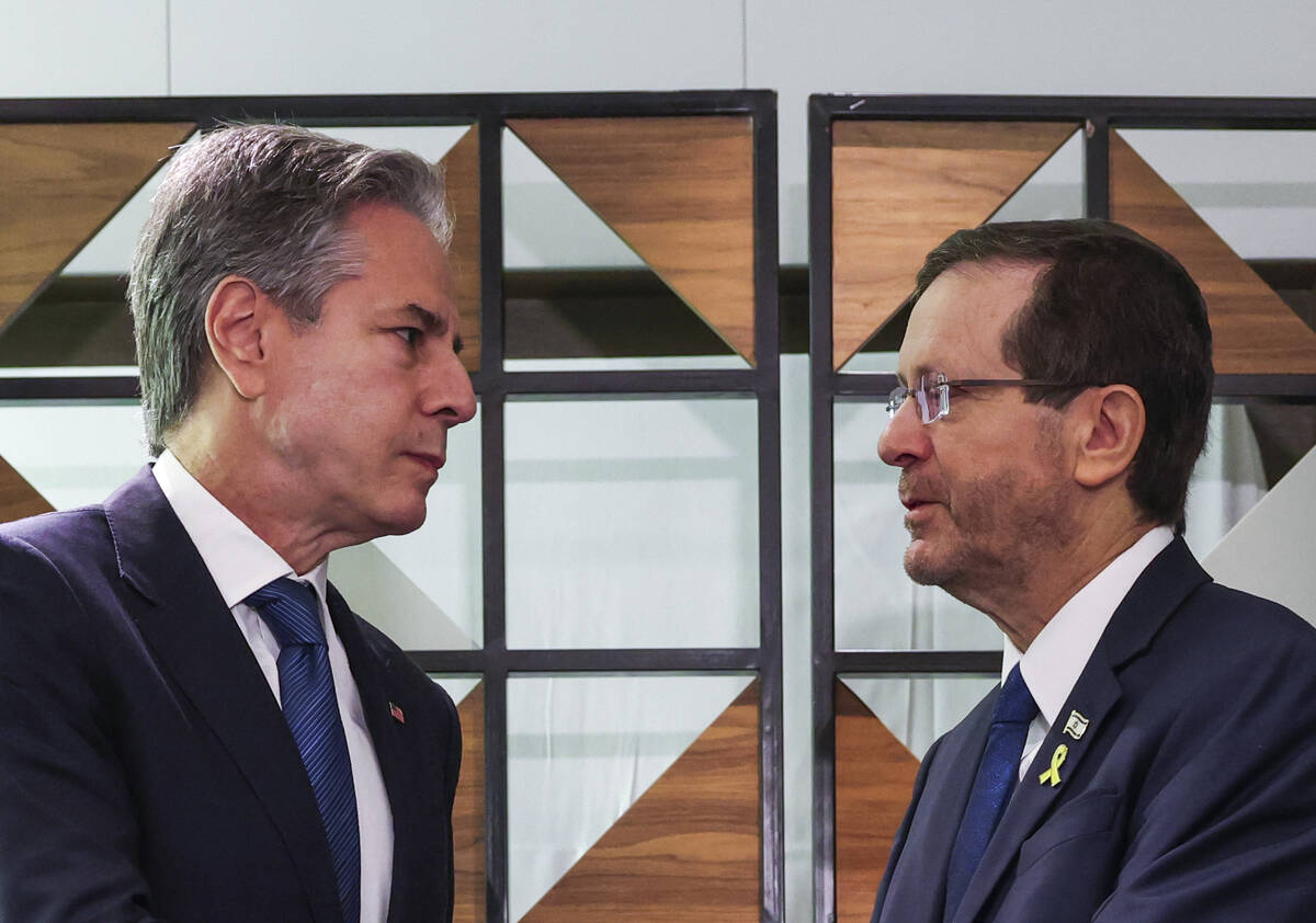 U.S. Secretary of State Antony Blinken, left, meets with Israel's President Isaac Herzog, in Te ...