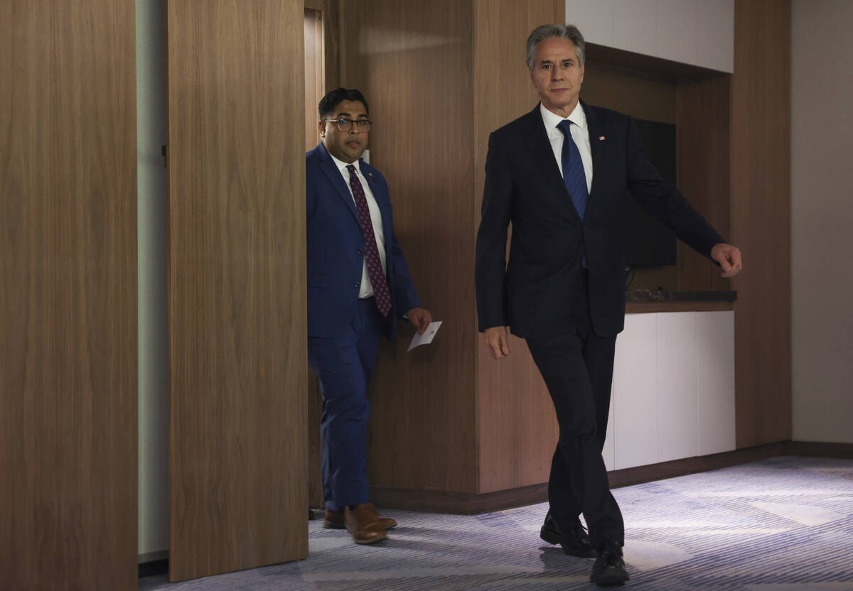 U.S. Secretary of State Antony Blinken, right, walks at the David Kempinski Hotel in Tel Aviv, ...