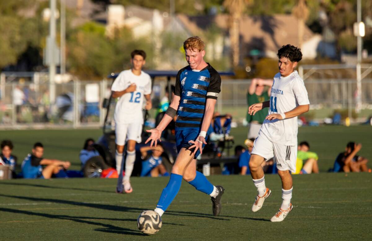 Basic junior Zaelur Burns (4) becomes frustrated with his team during the high school soccer ga ...