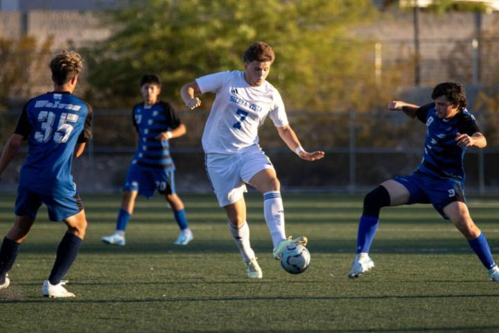 Sierra Vista midfielder Leon Mesic (7) moves the ball up the field during the high school socce ...