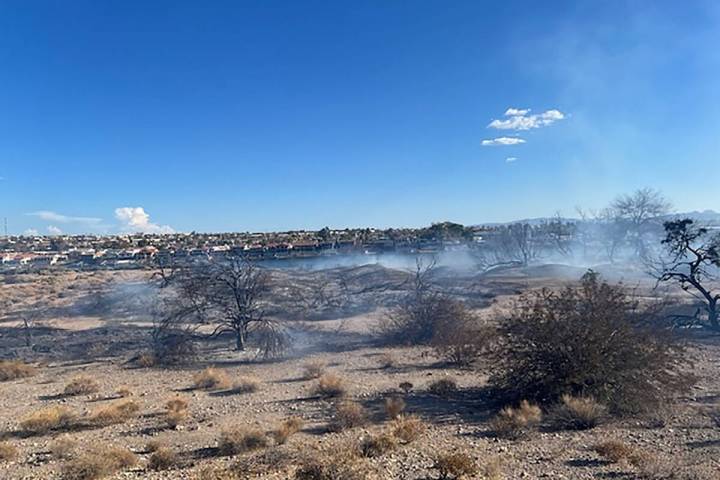 Smoke rises over a 63-acre brush fire between Laughlin and Bullhead City, Arizona, on Monday, , ...