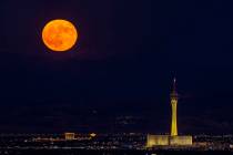 Monday’s blue moon is the third of the four full moons this summer. Is is seen over The Strat ...