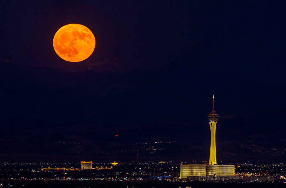 Monday’s blue moon is the third of the four full moons this summer. Is is seen over The Strat ...