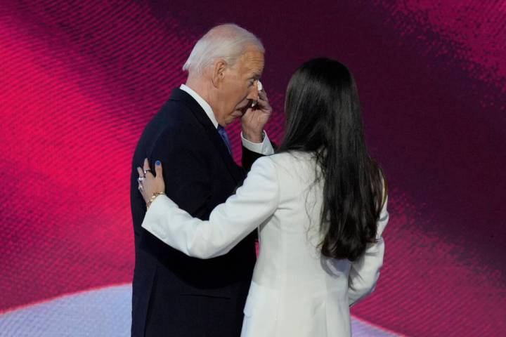 President Joe Biden, left, wipes his eyes after embracing his daughter Ashley Biden, right, on ...