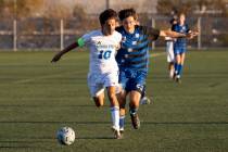 Sierra Vista senior Lazzar Ramos (10) and Basic junior Jeff Sesock (23) compete for the ball du ...