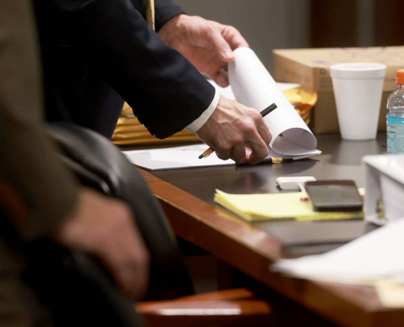 Robert Telles uses a grease pencil to take notes at the defense table in court on the seventh d ...