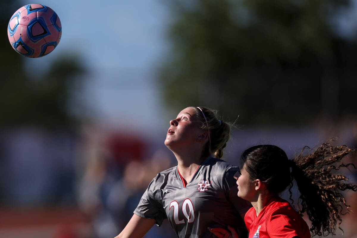 Arbor View’s Dakotta Larkin (20) and Coronado’s Josie Poniewaz vie for the ball d ...