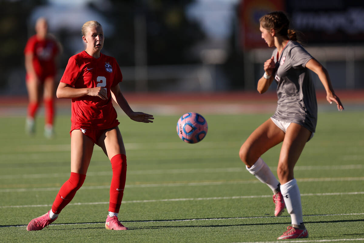 Coronado defender Emily McKinney (2) and Arbor View defender Cadence Atkins vie for the ball du ...