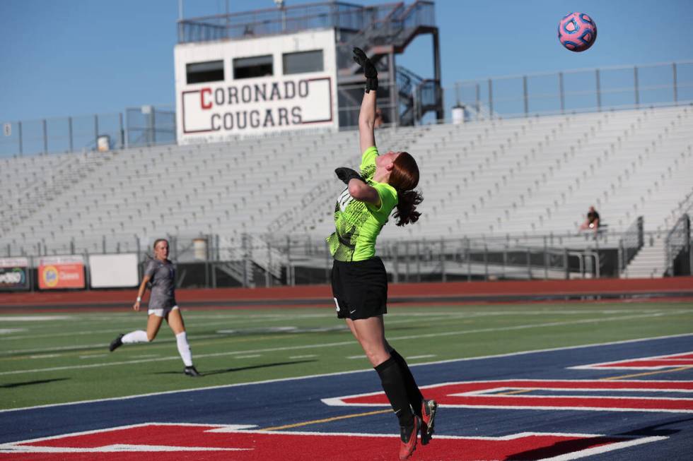 Coronado goaltender Emma Duda tips the ball for a save against Arbor View during a high school ...