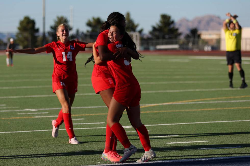 Coronado forward Abby Obregon, right, celebrates a goal with forward Jazmine McCallum, center, ...