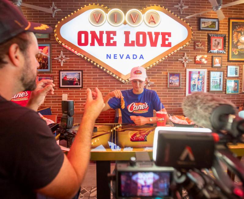 Olympic medalist Katie Grimes is directed specifically how to dunk a chicken finger into the sa ...