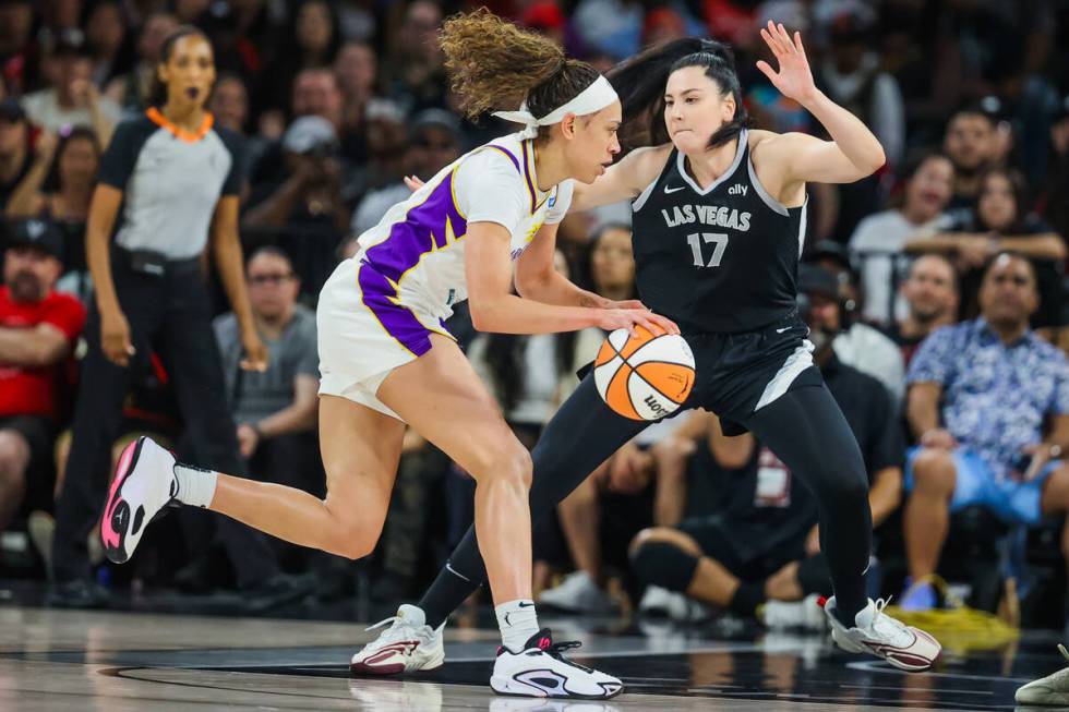 Aces center Megan Gustafson (17) guards Los Angeles Sparks forward Dearica Hamby (5) during a W ...